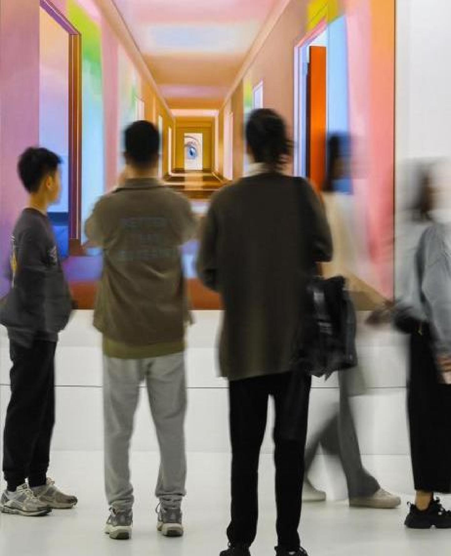 Visitors viewing an immersive contemporary art installation